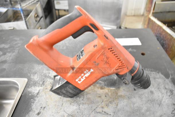 Hilti TE4-A18 drill, visible wear, features ergonomic handle, labeled "AWH Systs," auction lot includes 8 items.

