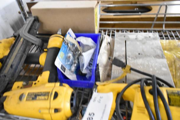 Assorted tools including DeWalt DW304 saw, DeWalt D51431 stapler, Bosch 1590EVS sander, Hilti TE4-A18, in used condition.