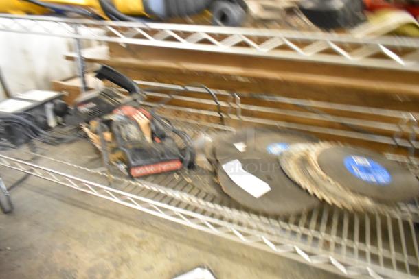 Blurred image showing a Craftsman scroller saw, various saw blades, and an Alfa transformer on a shelf. Items appear used.