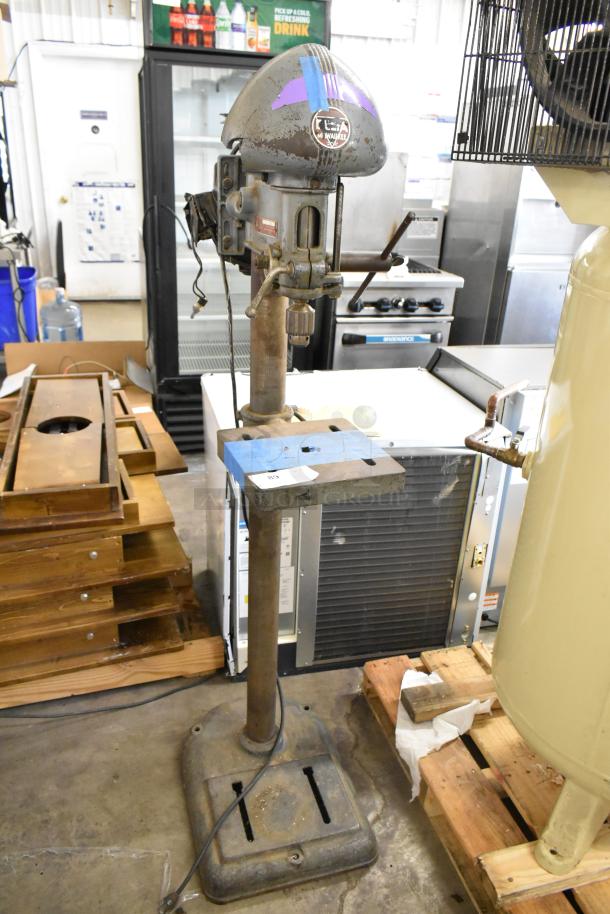 Delta/Milwaukee drill press, 120V, 1-phase, vintage model with visible wear, label intact, sturdy base.