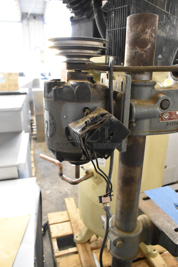 Delta/Milwaukee unit, 120V, 1-phase, industrial equipment. Features visible wiring and pulley system, fair condition.