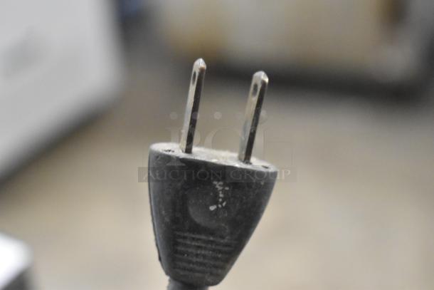 Delta/Milwaukee electrical plug, 120V, 1 phase, showing wear; key component for power connection.