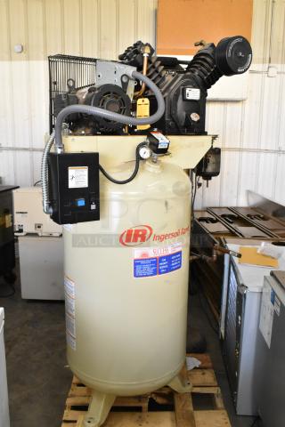 Ingersoll Rand 2475N5-V commercial air compressor, metal, vertical design, visible branding, control panel, in good condition.