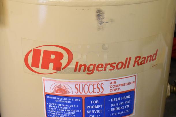 Ingersoll Rand 2475N5-V commercial air compressor, metal construction, visible branding, and service information label.