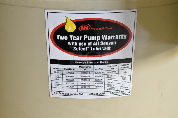 Ingersoll Rand 2475N5-V air compressor label showing two-year pump warranty and listed service kits for various models.