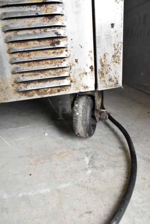 Silver King SKSD/C4 stainless steel cooler, visible rust on casters, 115V, 1 Phase. Ideal for commercial use.