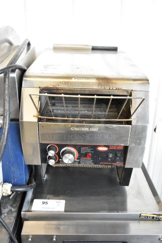 Hatco TQ-800HBA stainless steel commercial countertop conveyor toaster oven, 208 volts, 1 phase, with visible control knobs and "Caution Hot" label.