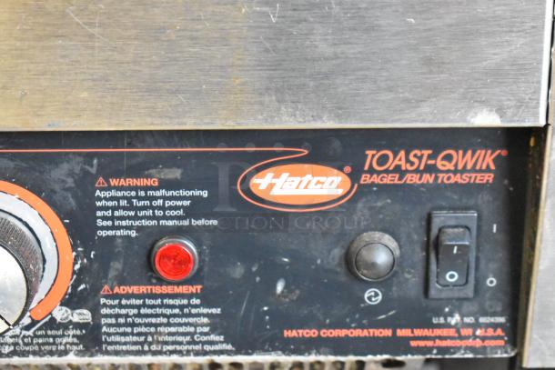 Hatco TQ-800HBA stainless steel conveyor toaster oven, showing control panel with warning label and power switch.