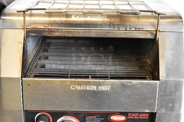 Hatco TQ-800HBA stainless steel commercial conveyor toaster oven, 208 volts, 1 phase. Visible wear, "Caution Hot" label.