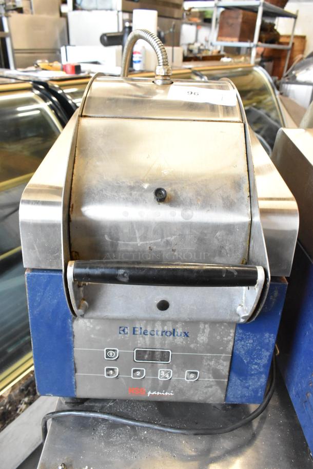 Electrolux HSPPAN metal commercial countertop panini press, 208 volts, 1 phase, used condition, visible control panel.