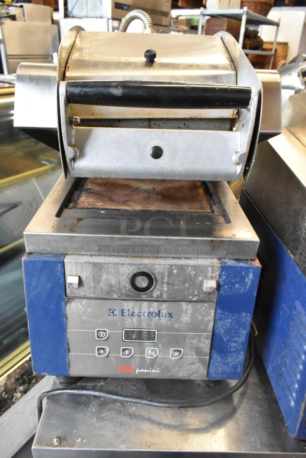 Electrolux HSPPAN commercial countertop panini press, 208V, 1 phase; visible wear, functional controls, branded markings.