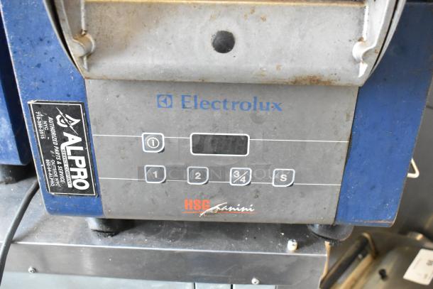 Electrolux HSPPAN commercial panini press. Metal body, digital buttons, 208V, 1 phase. Visible wear, ALPRO service label.