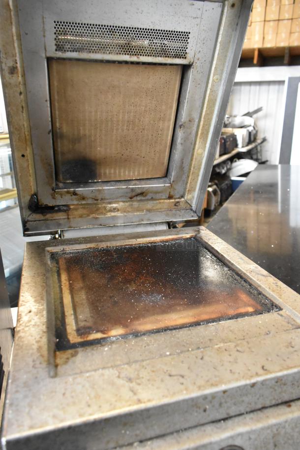 Electrolux HSPPAN metal commercial panini press, 208V, 1 phase, well-worn condition, open view of cooking surface.