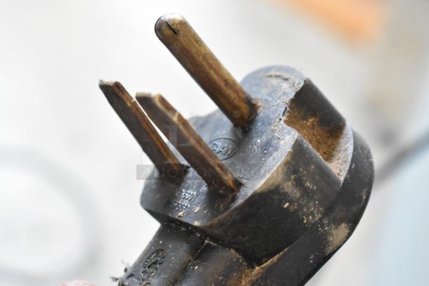 Close-up of an Electrolux HSPPAN metal panini press power plug, showing wear. 208V, 1 Phase, commercial use.