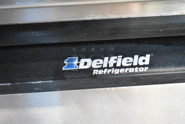 Delfield 18699PTT stainless steel commercial pizza prep table, labeled "Delfield Refrigerator." 115V, 1 phase.