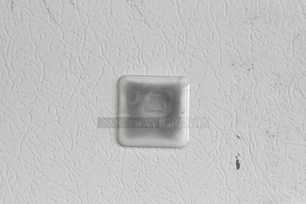 Maytag MQU2057AEW freezer label, textured surface, white background, indicating model and brand.