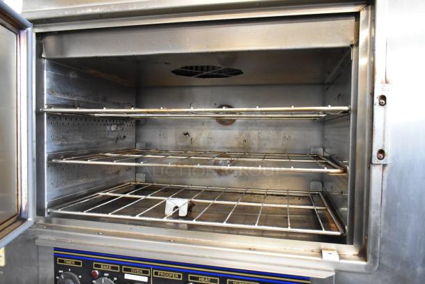 Nu Vu SUB-123 stainless steel commercial oven proofer with racks, on casters, 208V, 3-phase, controls labeled for timer, bake, oven.
