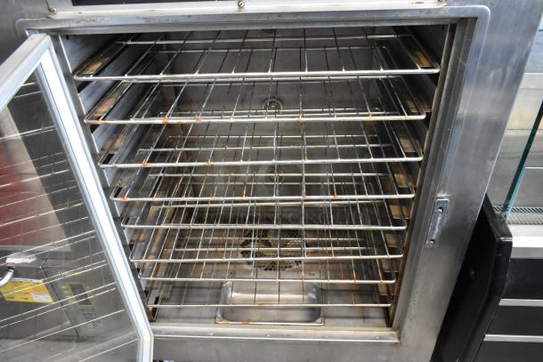 Nu Vu SUB-123 stainless steel commercial oven proofer with open door, multiple racks, on casters. 208V, 3 phase.