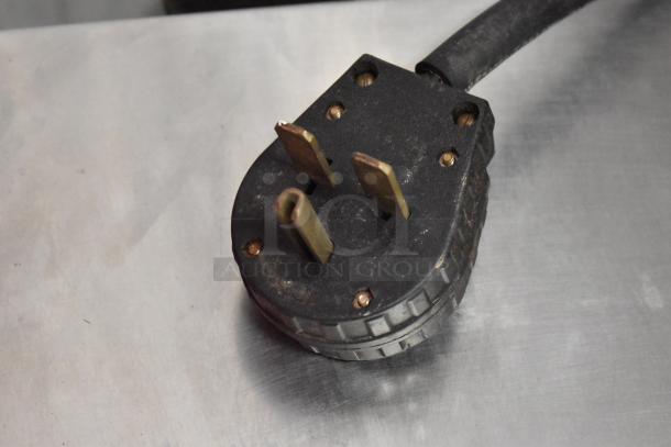 Turbochef NGC rapid cook oven power plug, showing a robust three-prong design for 208/240V, 1-phase connection.