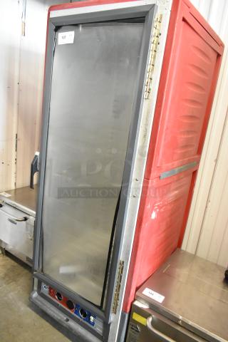 Metro C5 commercial heated holding cabinet, metal exterior, on casters, 120 volts, 1 phase, red with visible controls.