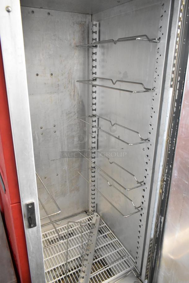 Metro C5 metal commercial heated holding cabinet in used condition, interior racks, on commercial casters, 120V, 1 Phase.