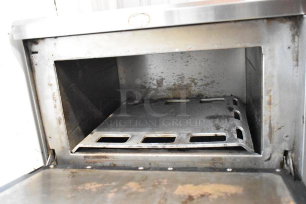 Turbochef NGC stainless steel rapid cook oven, electric, 208/240V, 1 phase. Used condition, visible interior wear.