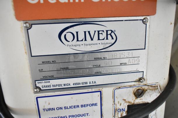 Oliver 702-N Metal Countertop Bagel Slicer, 115 Volts, 1 Phase. Serial No. 181531. Grand Rapids, MI. Used condition.