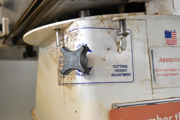 Oliver 702-N Metal Bagel Slicer, commercial countertop model. Features cutting height adjustment. Condition shows wear. 115V, 1 Phase.