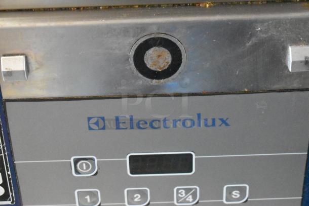 Electrolux HSPPAN metal commercial panini press, 208 volts, 1 phase, visible control panel, shows moderate wear.
