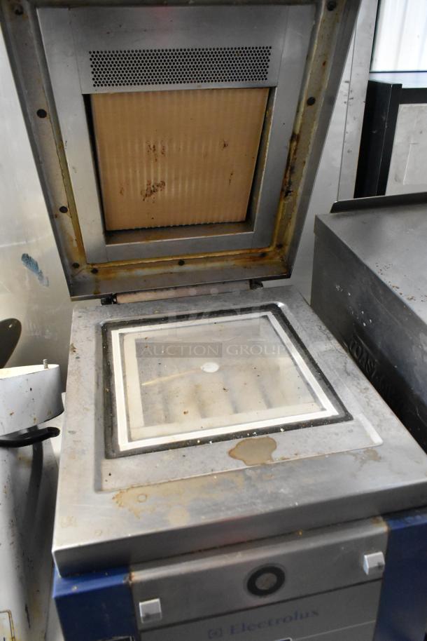 Electrolux HSPPAN metal commercial panini press, 208V, 1 phase, used condition with visible stains and wear.