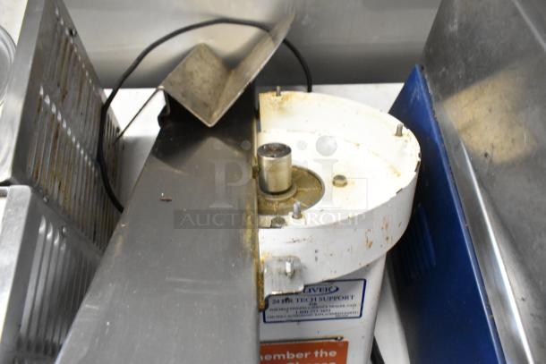 Oliver 702-N metal commercial countertop bagel slicer with visible wear. 115 volts, 1 phase, tech support label seen.