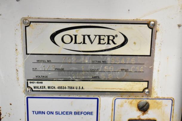 Oliver 702-N Metal Commercial Countertop Bagel Slicer, 115 Volts, 1 Phase. Model plate: Serial No. 195476.