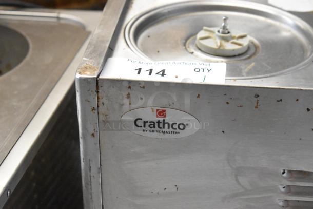 Crathco stainless steel commercial beverage machine base, 2 hopper, 115 volts, labeled "Crathco by Grindmaster," visible wear.