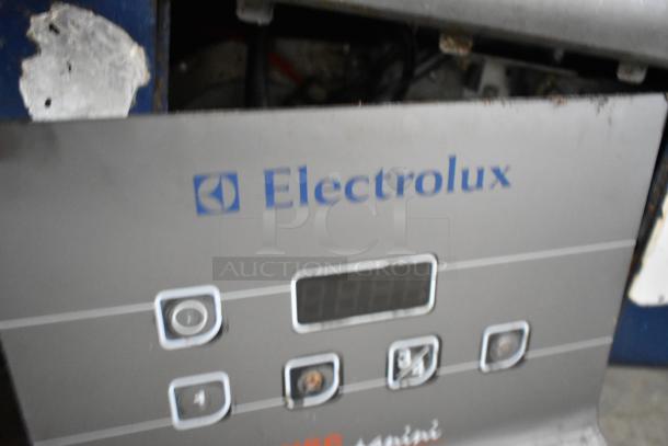 Electrolux HSPPAN metal commercial countertop panini press, 208 volts, 1 phase, with digital controls. Signs of wear visible.