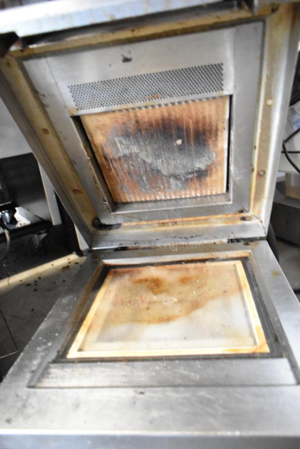 Electrolux HSPPAN metal commercial Panini press, showing interior grill and signs of wear. 208V, 1 phase.