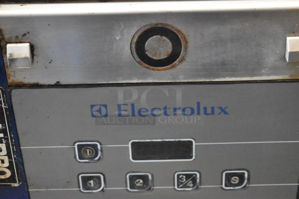 Electrolux HSPPAN commercial panini press, metal, 208V, 1 phase, shows some wear, features control panel and branding.