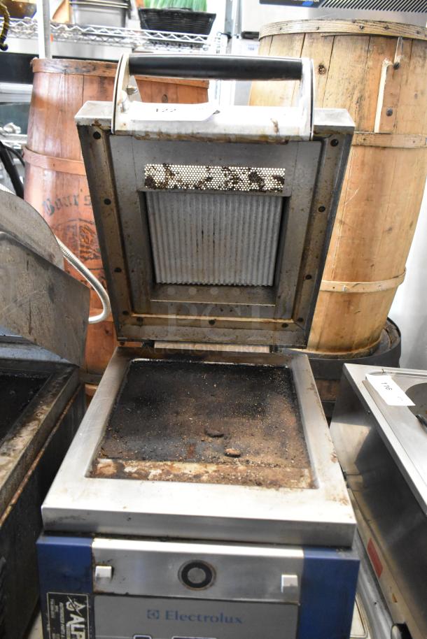 Electrolux HSPPAN metal commercial panini press, 208V, 1 phase, used condition, visible wear on grill plates.