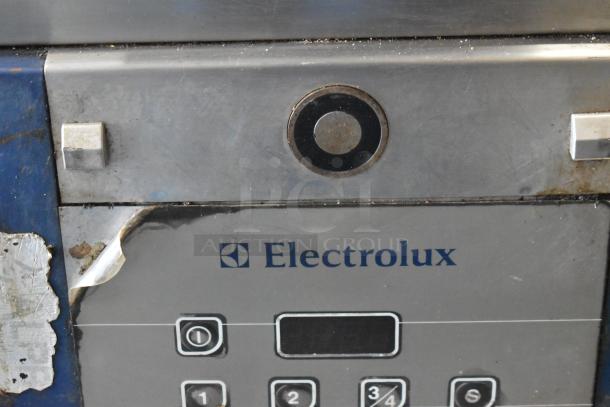 Electrolux HSPPAN commercial panini press, metal finish, visible wear, features keypad, 208V, 1 phase, model markings.