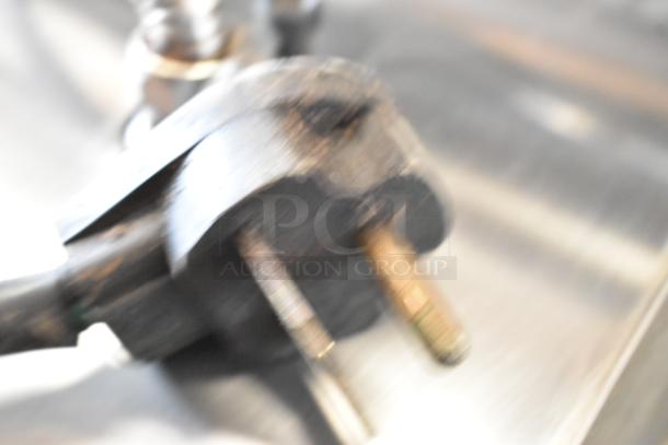 Blurry close-up of plug for Electrolux HSPPAN panini press, 208V, 1 phase. Condition and features unclear due to image quality.