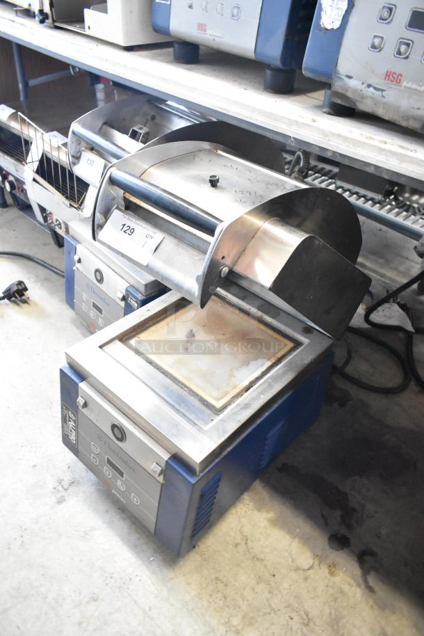 Electrolux HSPPAN metal commercial countertop panini press, 208 volts, 1 phase. Shows wear, with controls and branding visible.