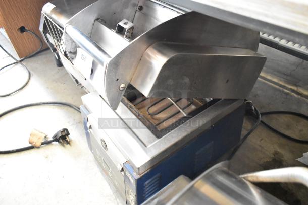 Electrolux HSPPAN commercial metal panini press, 208 volts, 1 phase, lightly worn, model label visible.