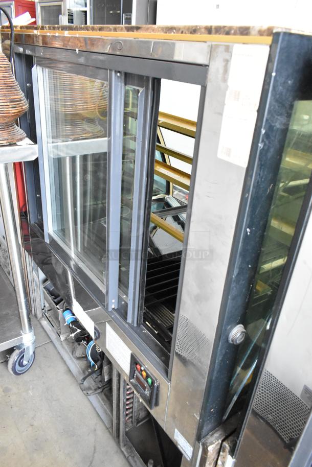 Kinco NSRM3 metal deli display case, commercial floor style, glass doors, 110 volts, 1 phase, in used condition.