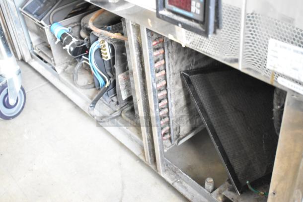 Kinco NSRM3 metal deli display case, 110V, 1 phase. Features internal components, metal construction, commercial use.