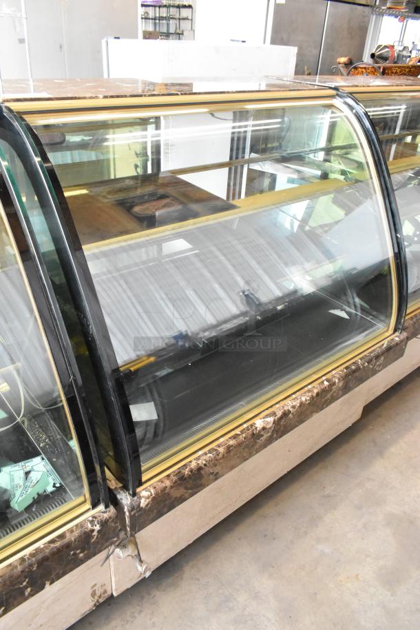 Kinco NSRM3 commercial deli display case, metal construction, glass front. Runs on 110 volts, 1 phase. Visible wear.