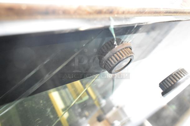 Kinco NSRM3 deli display case detail; features metal exterior, glass panels with wear, and control knobs. 110V, 1 Phase.