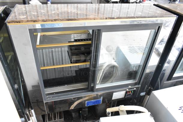 Kinco NSRM3 metal deli display case merchandiser, commercial floor style, with glass sliding doors and shelving. 110 volts, 1 phase.
