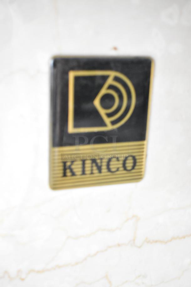 Kinco NSRM3 deli display case badge, black and gold, showing brand logo and name.