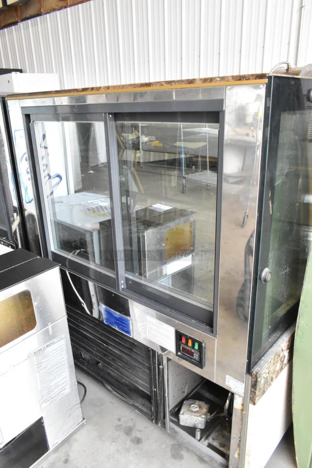 Kinco NSRM3 metal commercial deli display case, floor style, 110 volts, 1 phase, visible controls, used condition.