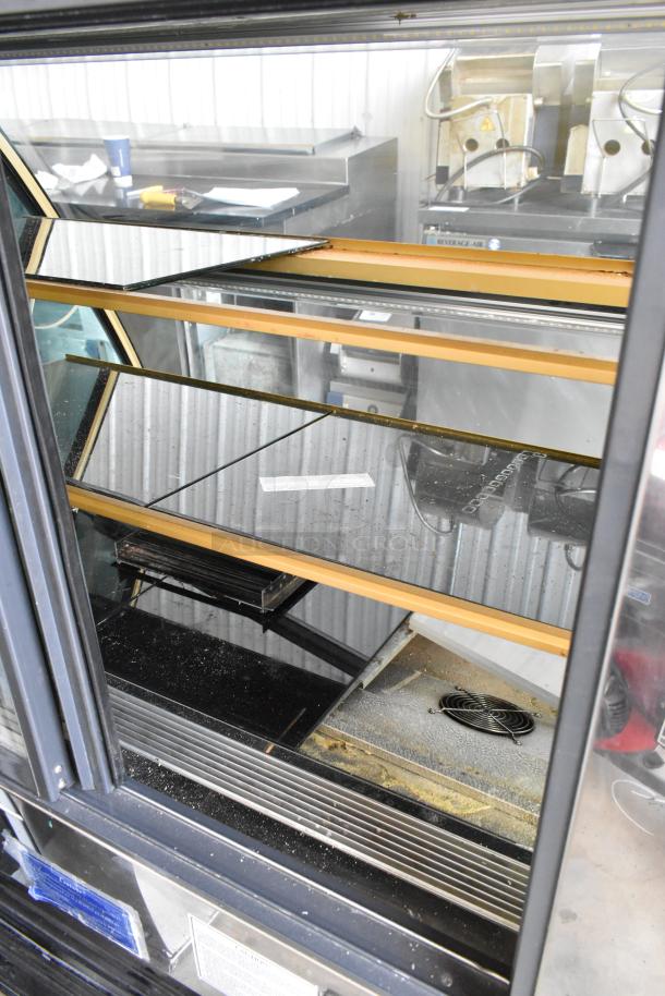 Kinco NSRM3 metal deli display case, 110V, 1 phase, commercial floor style. Features glass shelving, visible labels.