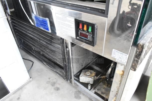 Kinco NSRM3 metal commercial deli display case, with controls, vents, and a visible label. 110 volts, 1 phase power.
